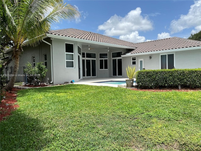 1290 Ginger Cir, Weston, FL 33326 - rear view of property featuring stucco siding, a tile roof, and ceiling fan