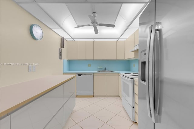 2500 Parkview Dr Unit 1717, Hallandale Beach, FL 33009 - kitchen with white appliances, cream cabinets, under cabinet range hood, ceiling fan, and light countertops