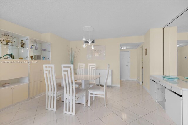 2500 Parkview Dr Unit 1717, Hallandale Beach, FL 33009 - dining area with light tile patterned flooring and baseboards