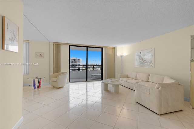 2500 Parkview Dr Unit 1717, Hallandale Beach, FL 33009 - living area with light tile patterned floors, expansive windows, and a textured ceiling