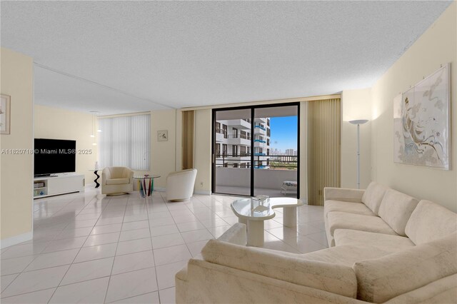 2500 Parkview Dr Unit 1717, Hallandale Beach, FL 33009 - living area with tile patterned floors and a textured ceiling