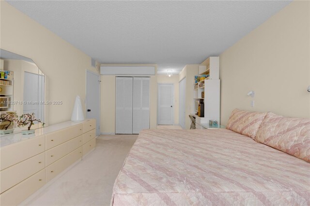 2500 Parkview Dr Unit 1717, Hallandale Beach, FL 33009 - bedroom with light carpet, a closet, and a textured ceiling