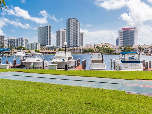 2500 Parkview Dr Unit 1717, Hallandale Beach, FL 33009 - dock area featuring a skyline view, a yard, and a water view