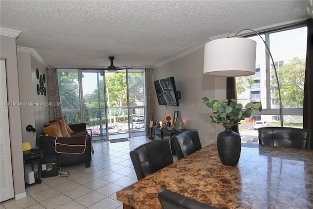 7125 NW 186th St Unit B311, Hialeah, FL 33015 - dining room featuring crown molding, a ceiling fan, a textured ceiling, light tile patterned floors, and floor to ceiling windows