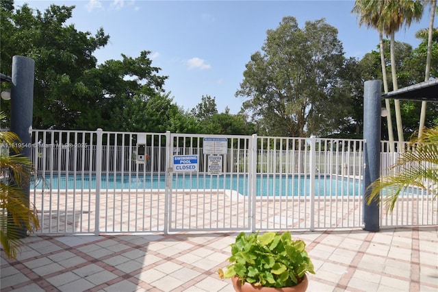 7125 NW 186th St Unit B311, Hialeah, FL 33015 - community pool featuring a patio area