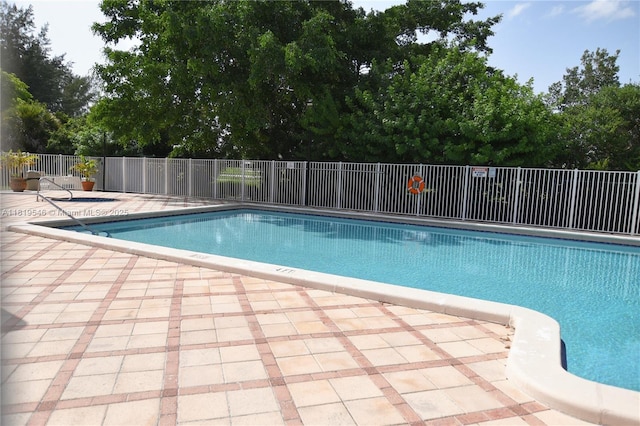 7125 NW 186th St Unit B311, Hialeah, FL 33015 - community pool featuring a patio area