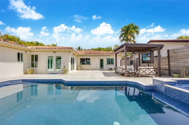 2085 Ixora Rd, North Miami, FL 33181 - rear view of house with an outdoor pool, a patio, and stucco siding