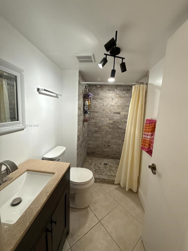 2900 Fiore Way Unit 1080, Delray Beach, FL 33445 - bathroom with vanity, a tile shower, and tile patterned flooring