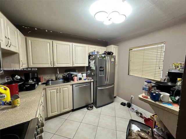 2900 Fiore Way Unit 1080, Delray Beach, FL 33445 - kitchen featuring appliances with stainless steel finishes, light tile patterned floors, and light countertops