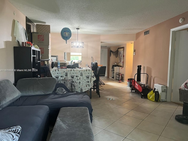 2900 Fiore Way Unit 1080, Delray Beach, FL 33445 - living area featuring light tile patterned floors and a textured ceiling