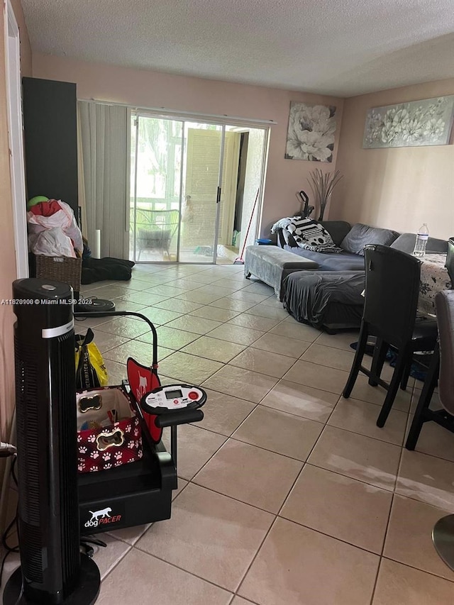 2900 Fiore Way Unit 1080, Delray Beach, FL 33445 - tiled living area featuring a textured ceiling