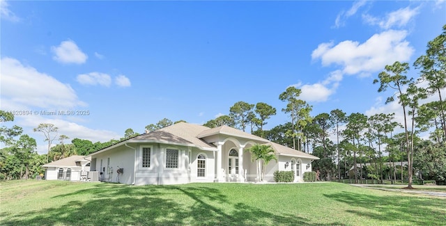 17038 N 61st Pl N, Loxahatchee, FL 33470 - view of front of house featuring a front lawn and stucco siding