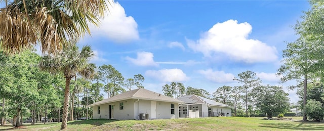 17038 N 61st Pl N, Loxahatchee, FL 33470 - view of side of home featuring stucco siding