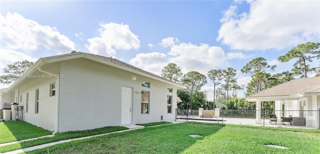 17038 N 61st Pl N, Loxahatchee, FL 33470 - view of yard with a patio