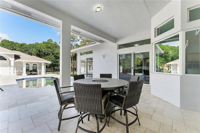 17038 N 61st Pl N, Loxahatchee, FL 33470 - view of patio featuring an outdoor pool and outdoor dining area