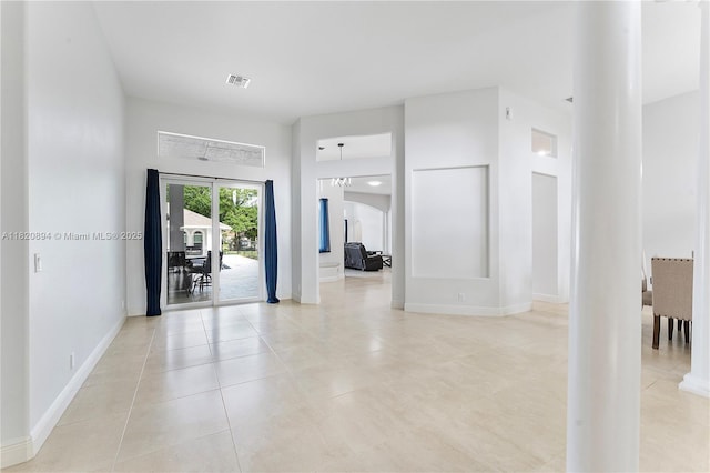 17038 N 61st Pl N, Loxahatchee, FL 33470 - spare room featuring light tile patterned flooring and arched walkways