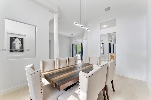 17038 N 61st Pl N, Loxahatchee, FL 33470 - dining room featuring light tile patterned floors and ornate columns