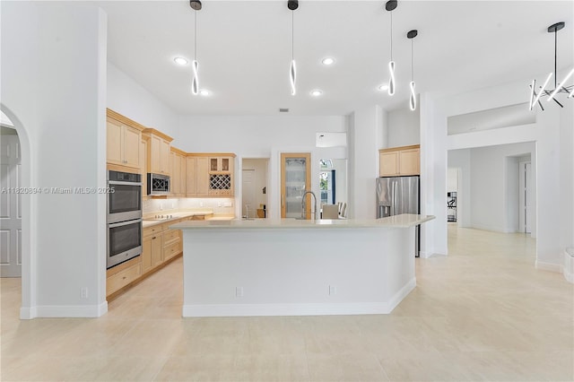 17038 N 61st Pl N, Loxahatchee, FL 33470 - kitchen with light brown cabinets, stainless steel appliances, light countertops, tasteful backsplash, and recessed lighting