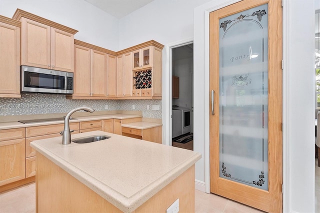 17038 N 61st Pl N, Loxahatchee, FL 33470 - kitchen with stainless steel microwave, light brown cabinets, tasteful backsplash, and light tile patterned floors