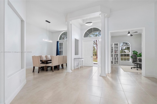 17038 N 61st Pl N, Loxahatchee, FL 33470 - foyer entrance featuring ornate columns, a towering ceiling, light tile patterned floors, and ceiling fan