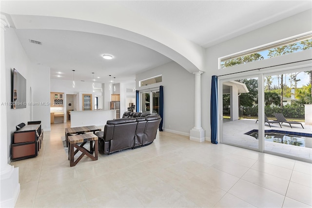 17038 N 61st Pl N, Loxahatchee, FL 33470 - living area with ornate columns, arched walkways, and light tile patterned floors