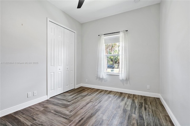 17038 N 61st Pl N, Loxahatchee, FL 33470 - unfurnished bedroom featuring a closet, wood finished floors, and ceiling fan