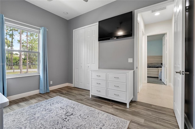 17038 N 61st Pl N, Loxahatchee, FL 33470 - unfurnished bedroom featuring wood finished floors and a closet