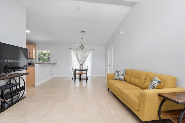 17038 N 61st Pl N, Loxahatchee, FL 33470 - living area with a chandelier, vaulted ceiling, and light tile patterned floors