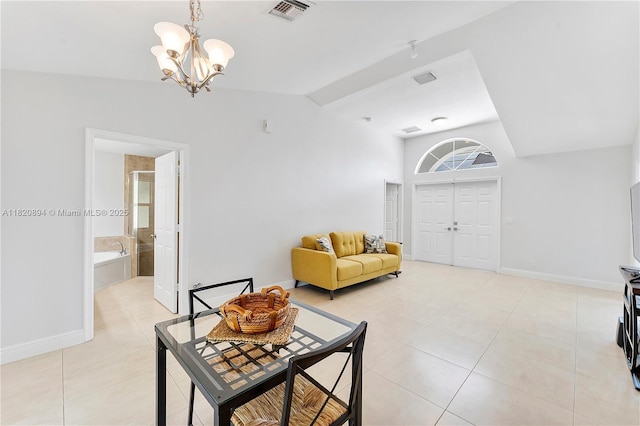 17038 N 61st Pl N, Loxahatchee, FL 33470 - living area featuring a chandelier, light tile patterned floors, and lofted ceiling