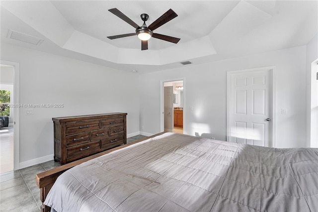 17038 N 61st Pl N, Loxahatchee, FL 33470 - bedroom with a tray ceiling, a ceiling fan, and ensuite bathroom