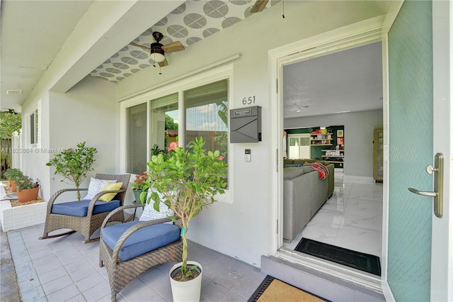 651 E Evanston Cir, Fort Lauderdale, FL 33312 - doorway to property featuring a ceiling fan and stucco siding