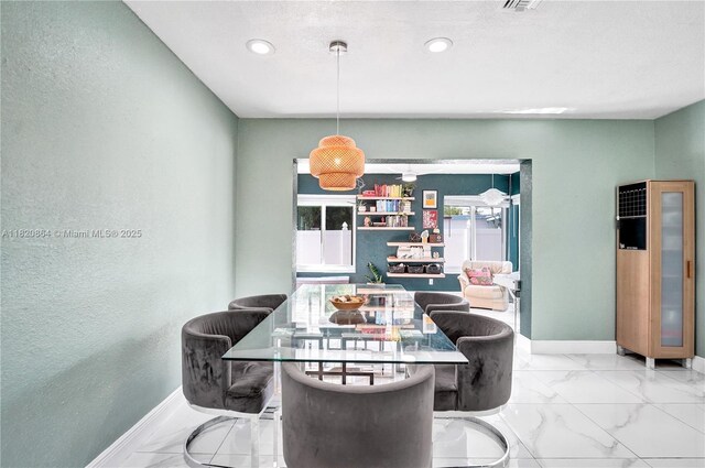 651 E Evanston Cir, Fort Lauderdale, FL 33312 - dining room featuring marble finish flooring, a heating unit, recessed lighting, and a textured wall