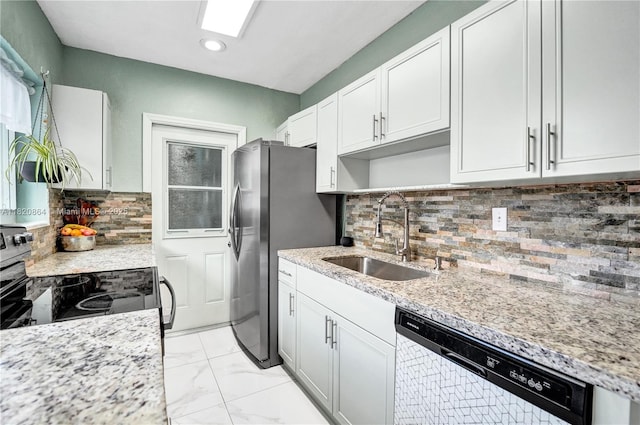 651 E Evanston Cir, Fort Lauderdale, FL 33312 - kitchen with appliances with stainless steel finishes, backsplash, white cabinetry, light marble finish floors, and recessed lighting