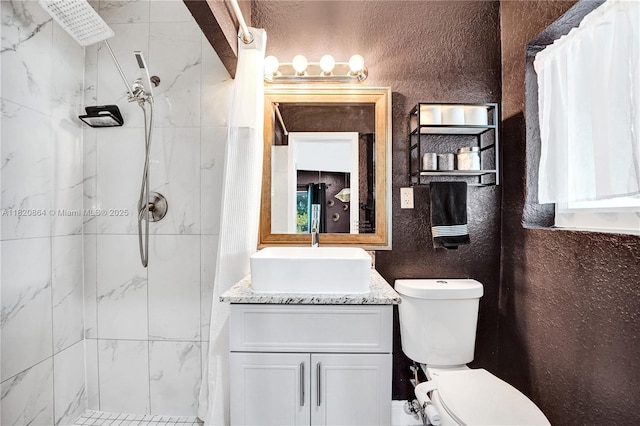 651 E Evanston Cir, Fort Lauderdale, FL 33312 - bathroom with a stall shower, vanity, and a textured wall