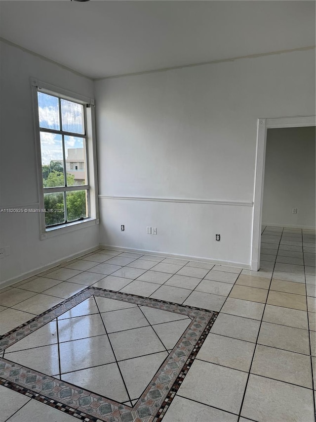 7400 W 20th Ave Unit 416, Hialeah, FL 33016 - tiled spare room with baseboards and inlaid floor details