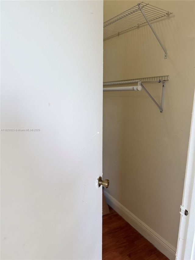 7400 W 20th Ave Unit 416, Hialeah, FL 33016 - spacious closet with wood finished floors