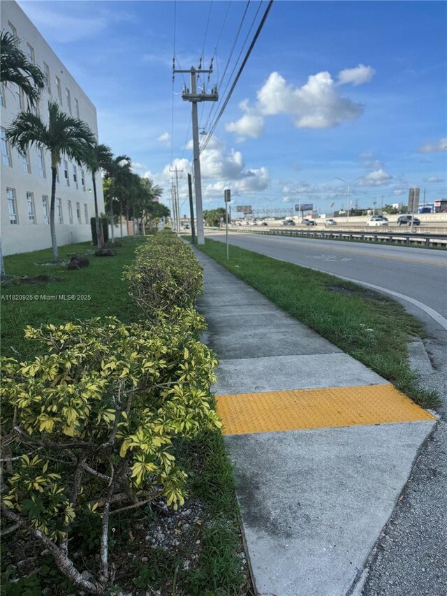 7400 W 20th Ave Unit 416, Hialeah, FL 33016 - view of asphalt street featuring sidewalks and street lights