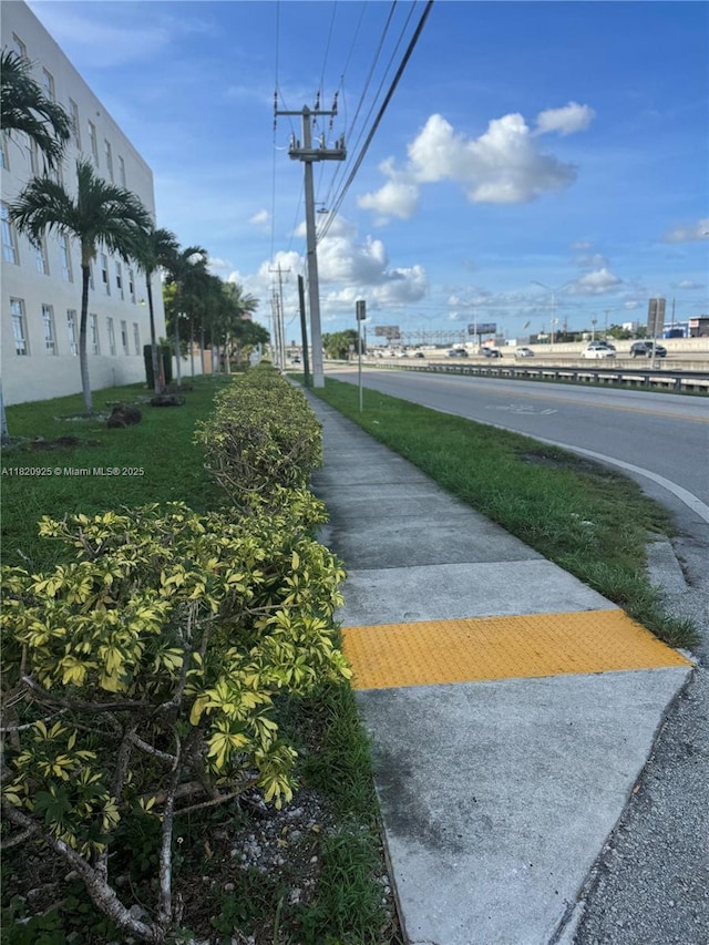 7400 W 20th Ave Unit 416, Hialeah, FL 33016 - view of asphalt street featuring sidewalks and street lights