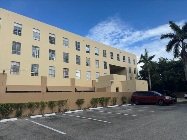 7400 W 20th Ave Unit 416, Hialeah, FL 33016 - view of apartment building / complex with uncovered parking