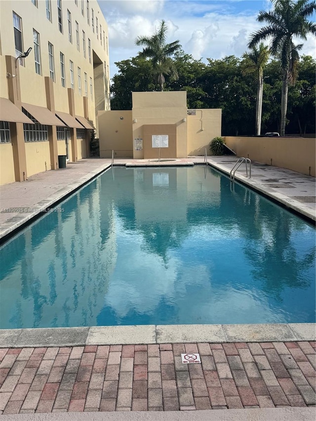 7400 W 20th Ave Unit 416, Hialeah, FL 33016 - community pool featuring a patio