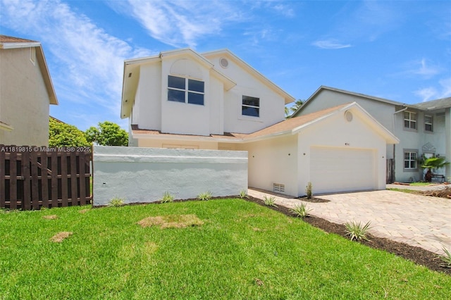 9741 SW 12th St, Pembroke Pines, FL 33025 - view of front of house with stucco siding, an attached garage, and decorative driveway