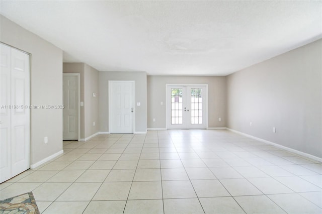9741 SW 12th St, Pembroke Pines, FL 33025 - spare room featuring light tile patterned floors and french doors
