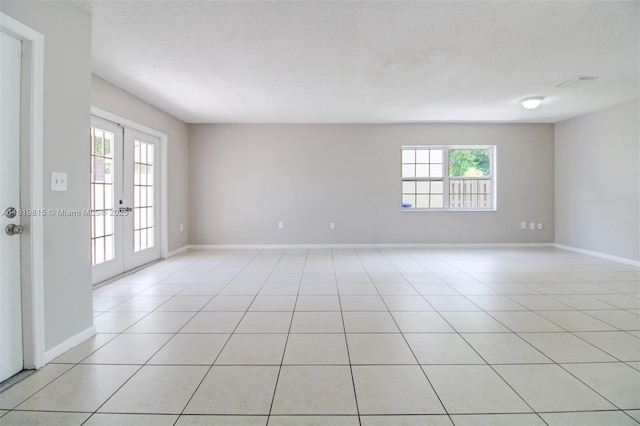 9741 SW 12th St, Pembroke Pines, FL 33025 - unfurnished room featuring healthy amount of natural light, french doors, and light tile patterned floors