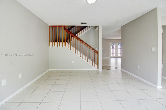 9741 SW 12th St, Pembroke Pines, FL 33025 - unfurnished living room featuring stairway, french doors, and light tile patterned flooring