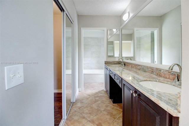 9741 SW 12th St, Pembroke Pines, FL 33025 - full bathroom with double vanity, tile patterned flooring, and a garden tub
