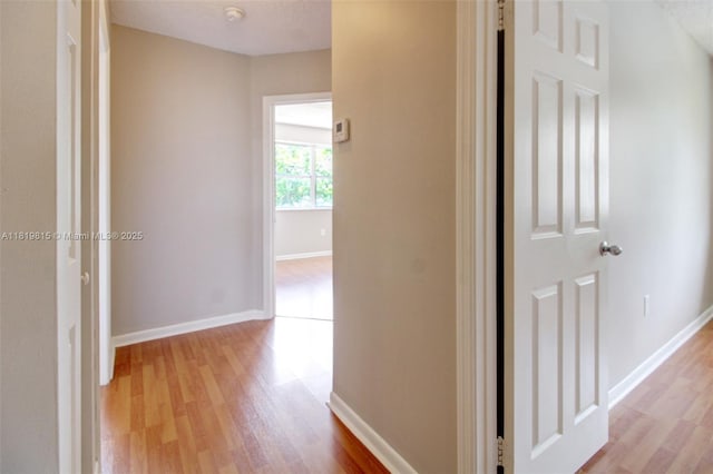 9741 SW 12th St, Pembroke Pines, FL 33025 - hall featuring light wood-style floors and baseboards