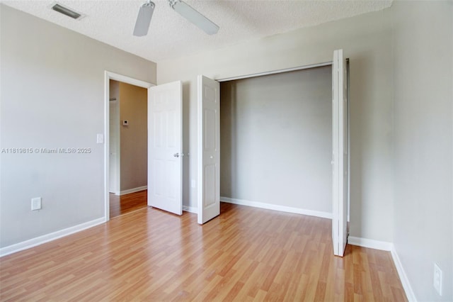 9741 SW 12th St, Pembroke Pines, FL 33025 - unfurnished bedroom with light wood-type flooring, a textured ceiling, a closet, and a ceiling fan