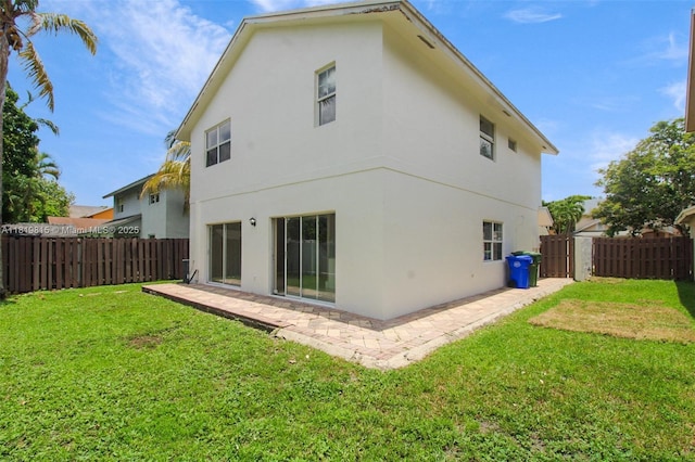 9741 SW 12th St, Pembroke Pines, FL 33025 - rear view of property with stucco siding and a patio area
