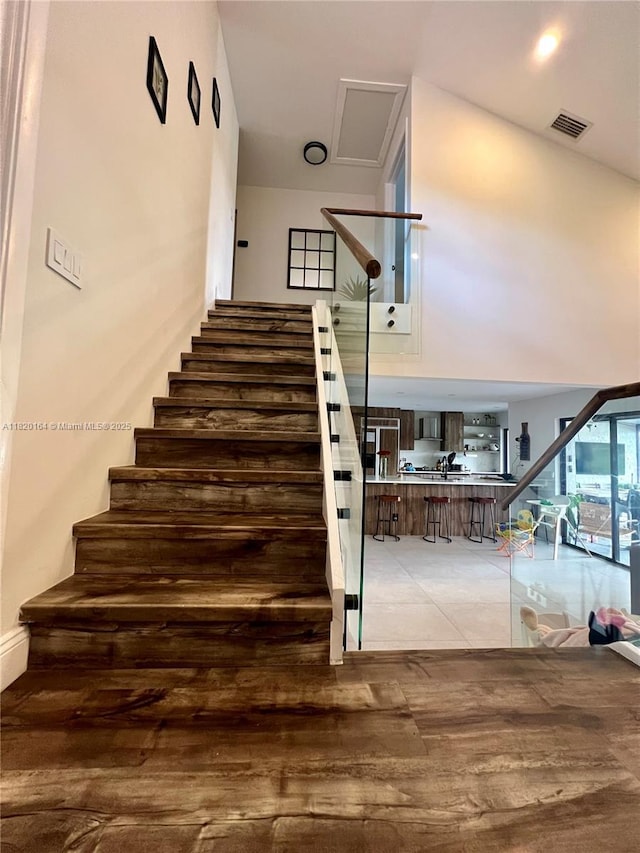 3003 Deer Creek Lake Shore Dr Unit 3003, Deerfield Beach, FL 33442 - stairs featuring wood finished floors