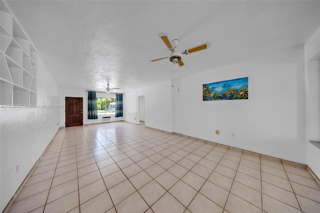 810 NE 119th St, Biscayne Park, FL 33161 - unfurnished living room featuring ceiling fan and light tile patterned floors